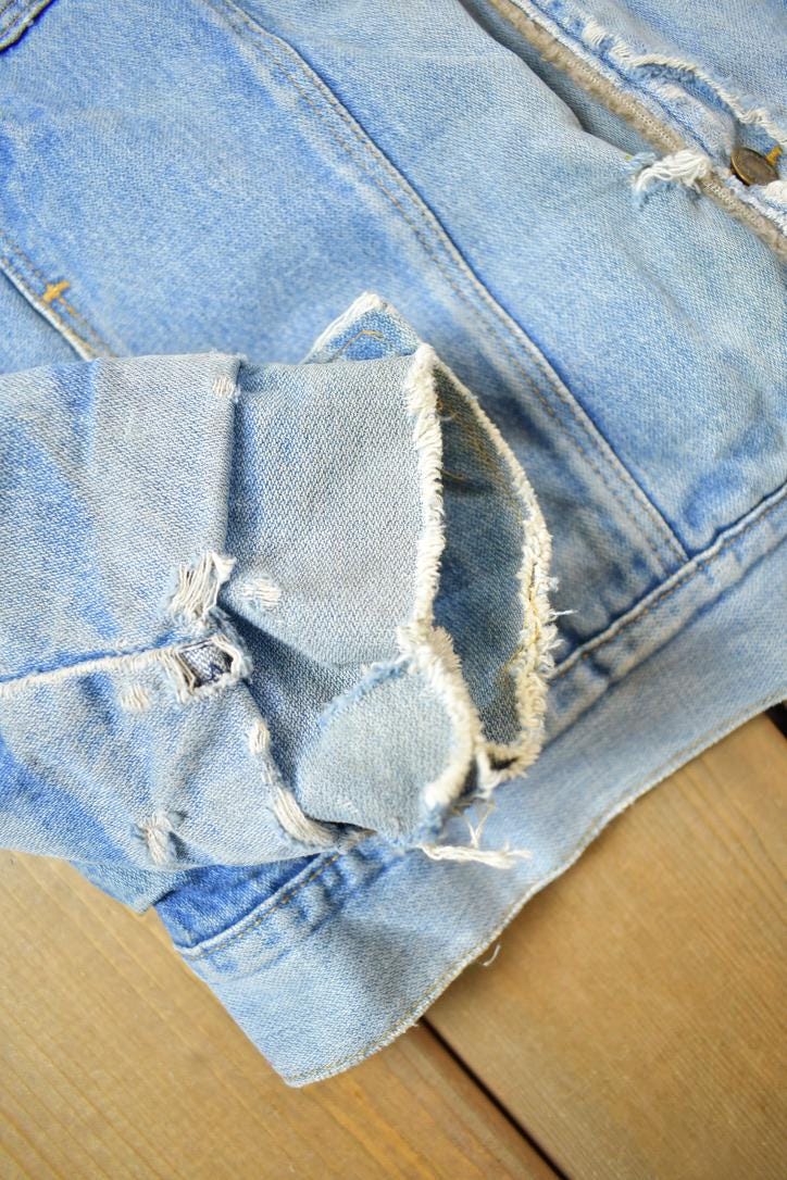 Vintage 1990s Distressed Faded Wrangler Synthetic Fur Lined Jean Jacket from propervintagecanada