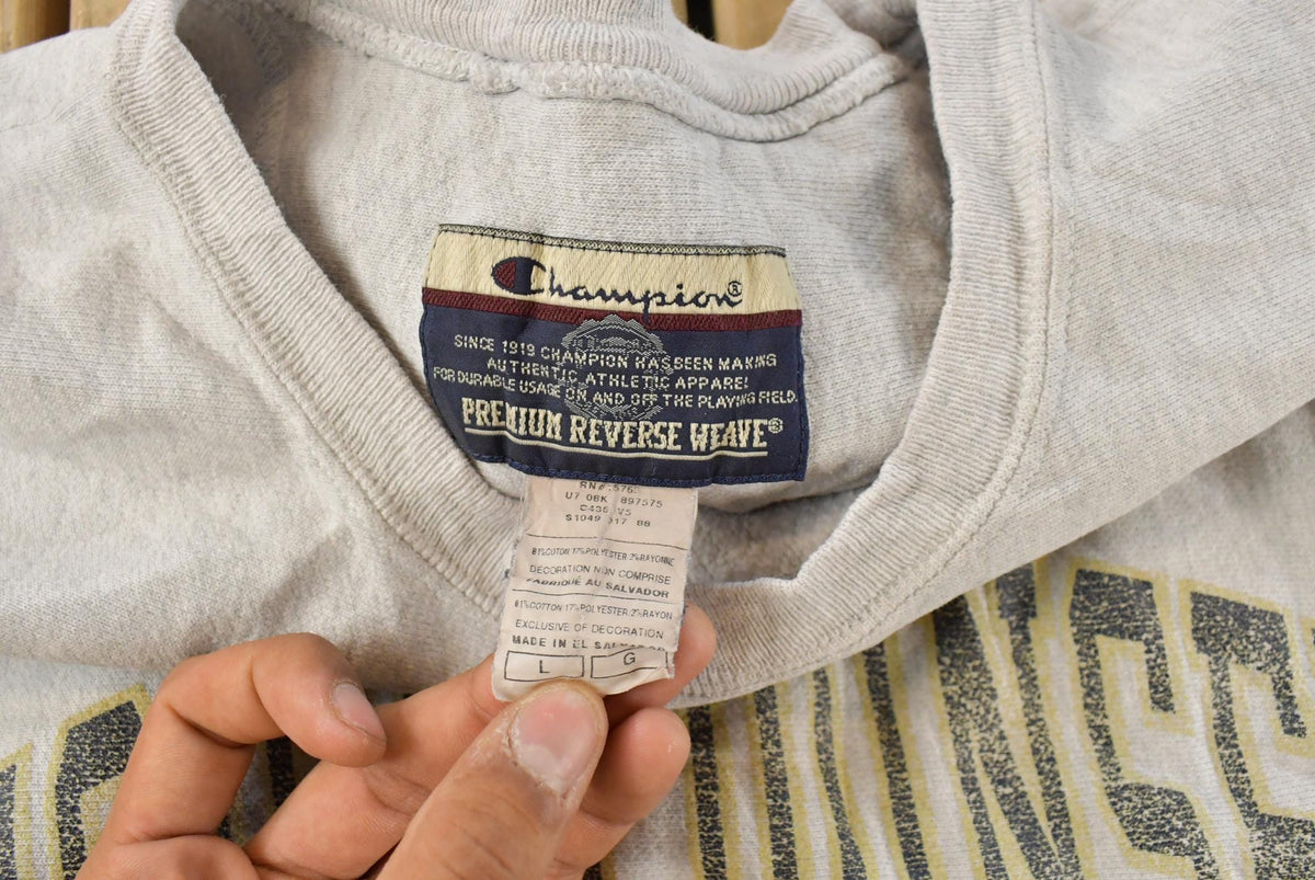 Vintage 1990s Distressed Good Counsel Champion Reverse Weave Crewneck Sweatshirt Men's L from propervintagecanada