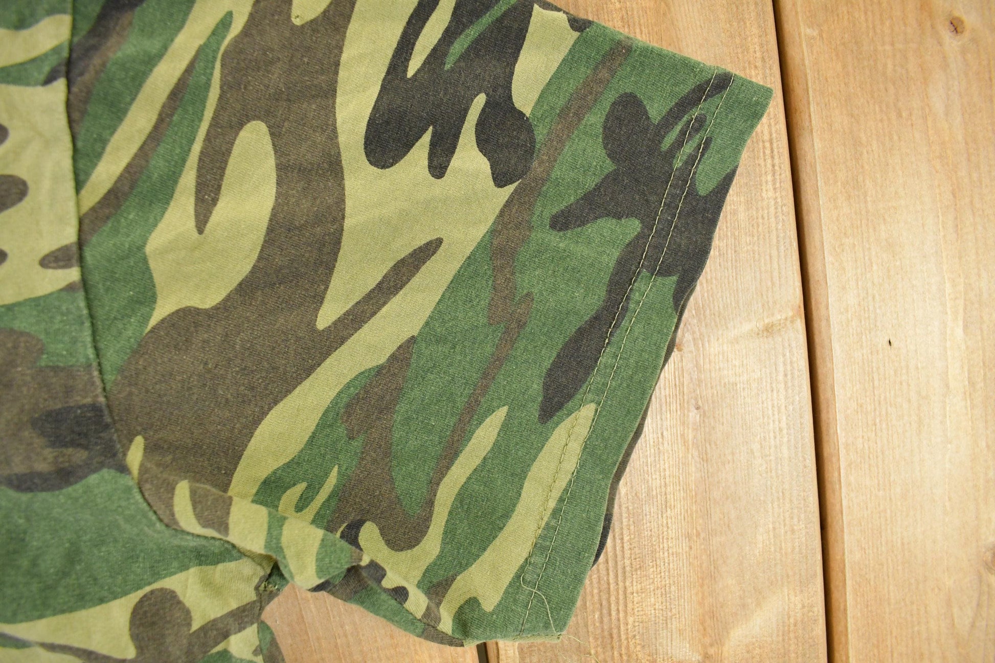 Vintage 1990s Distressed Woodland Camo T-Shirt Men's Large from propervintagecanada