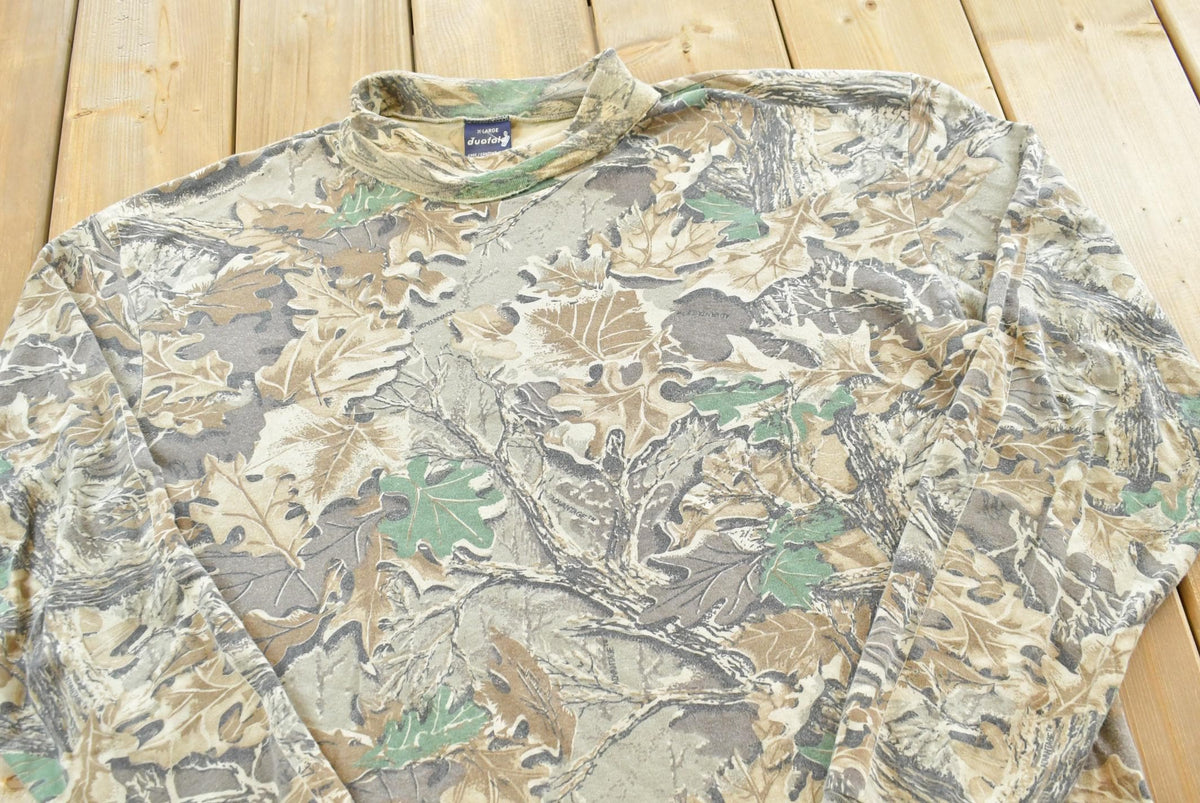 Vintage 1990s Duofold Advantage Camo Turtleneck Long Sleeve T-Shirt Men's XL from propervintagecanada