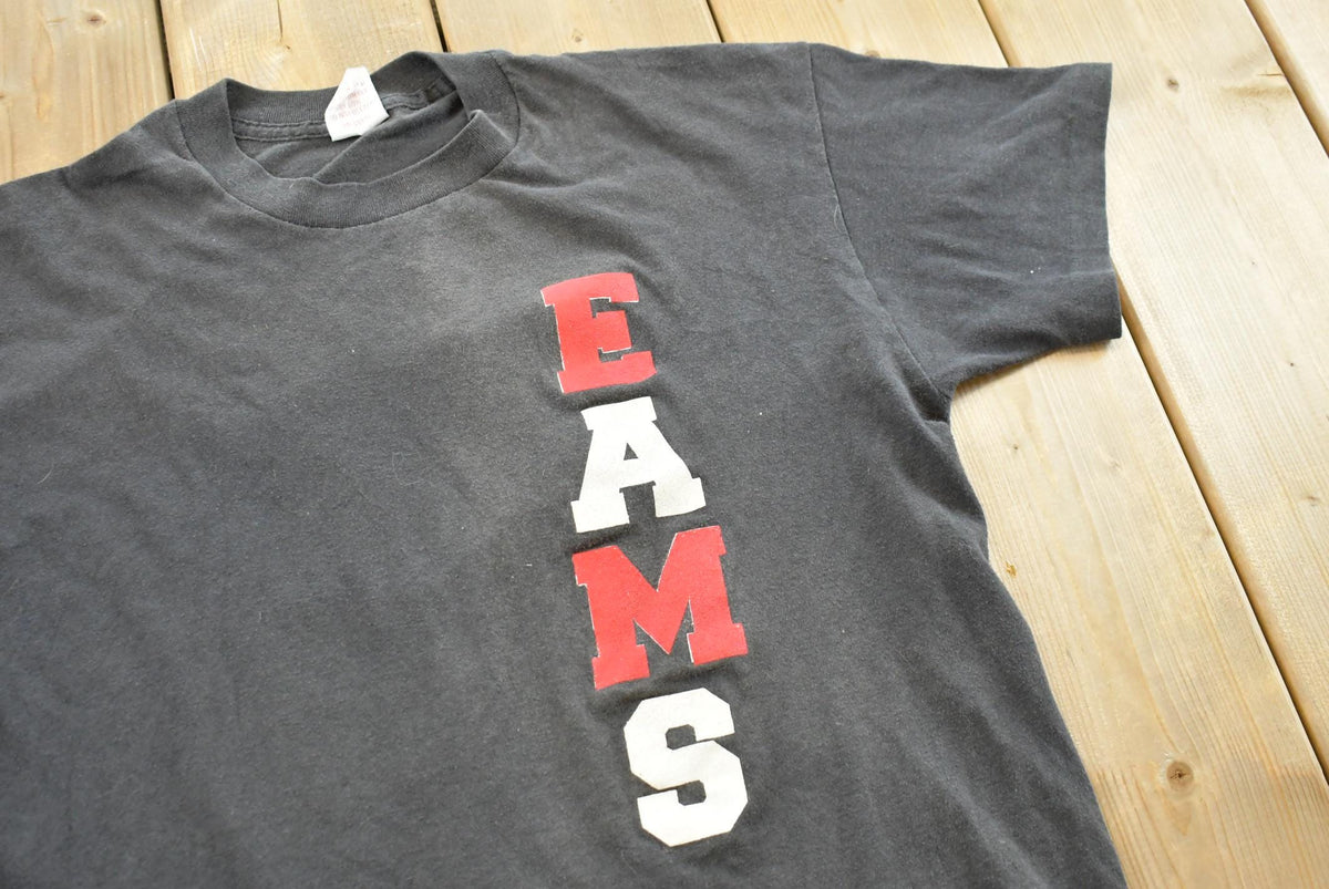Vintage 1990s EAMS Big E Souvenir Graphic Print T-Shirt Mens M from propervintagecanada
