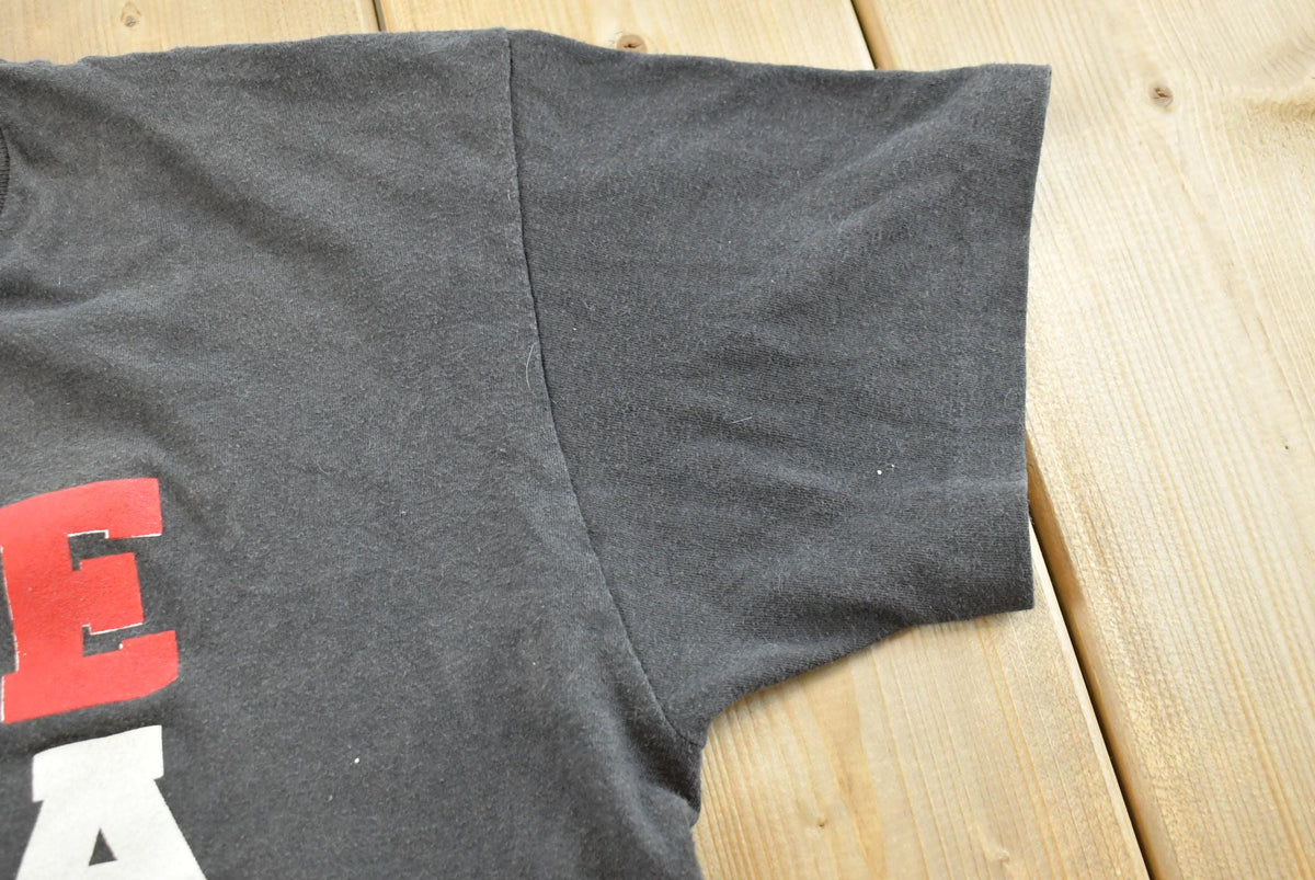 Vintage 1990s EAMS Big E Souvenir Graphic Print T-Shirt Mens M from propervintagecanada