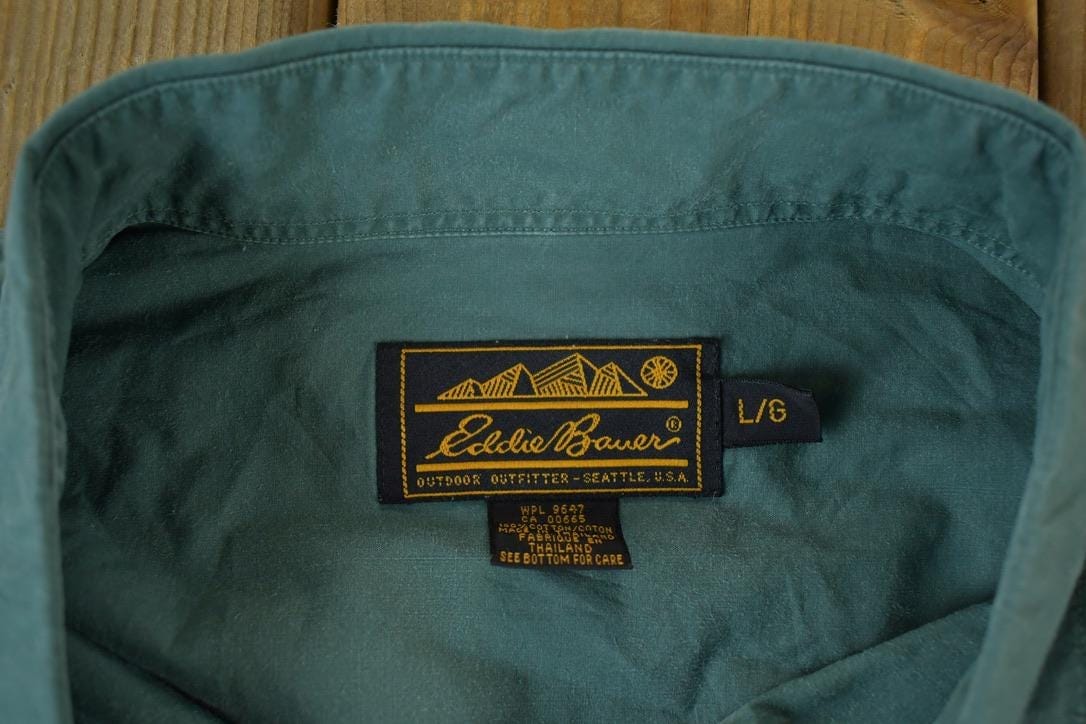 Vintage 1990s Eddie Bauer Button Up Souvenir Single Stitch Graphic Print T-Shirt Men's Large from propervintagecanada