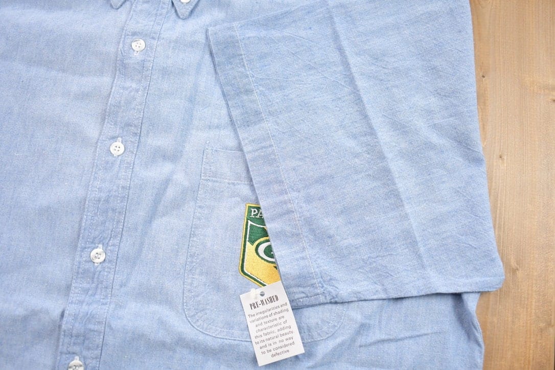 Vintage 1990s Embroidered Green Bay Packers NFL Denim Button Up T-Shirt Men's 2XL from propervintagecanada