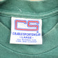 Vintage 1990s Embroidered Green Bay Packers World Champ 1965 NFL Graphic T-Shirt Men's Large from propervintagecanada