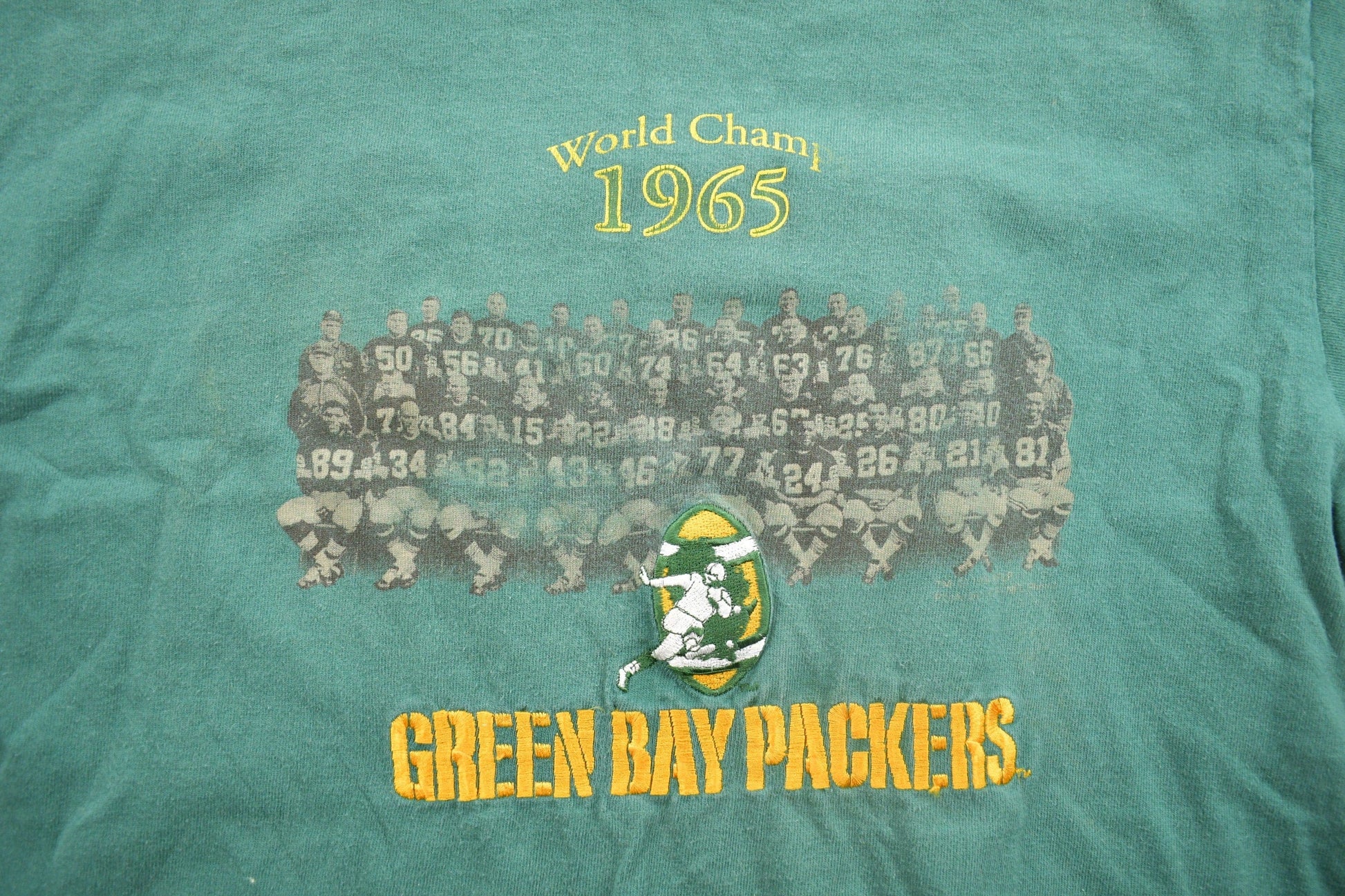 Vintage 1990s Embroidered Green Bay Packers World Champ 1965 NFL Graphic T-Shirt Men's Large from propervintagecanada