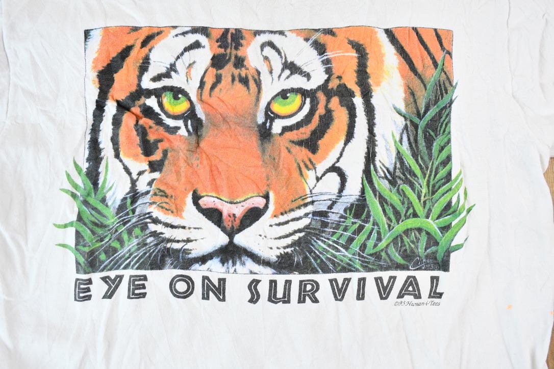 Vintage 1990s Eyes on Survival Realistic Tiger Theme Single Stitch Graphic T-Shirt Men's XS from propervintagecanada
