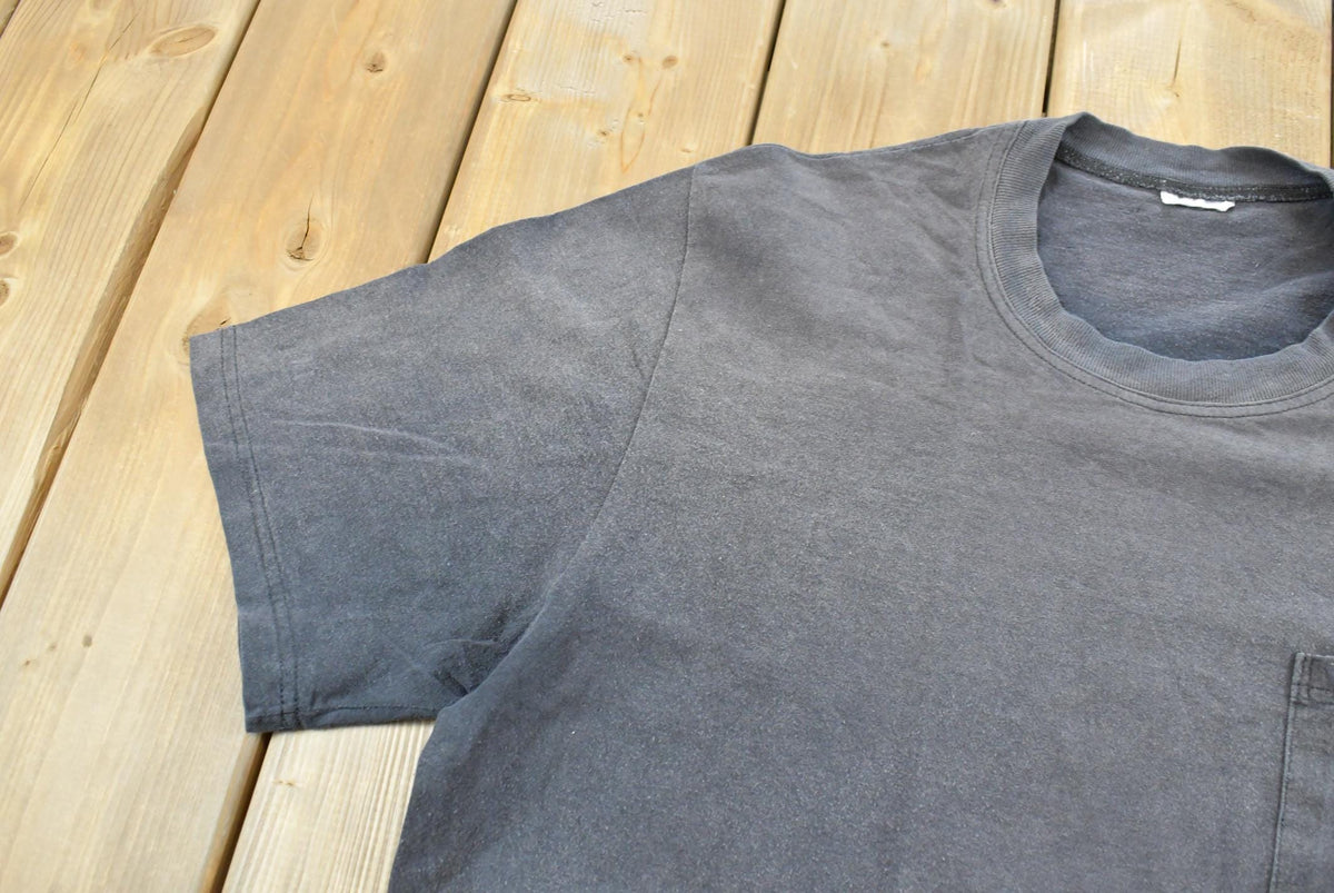 Vintage 1990s Faded Blank Black Pocket T-Shirt Men's L from propervintagecanada