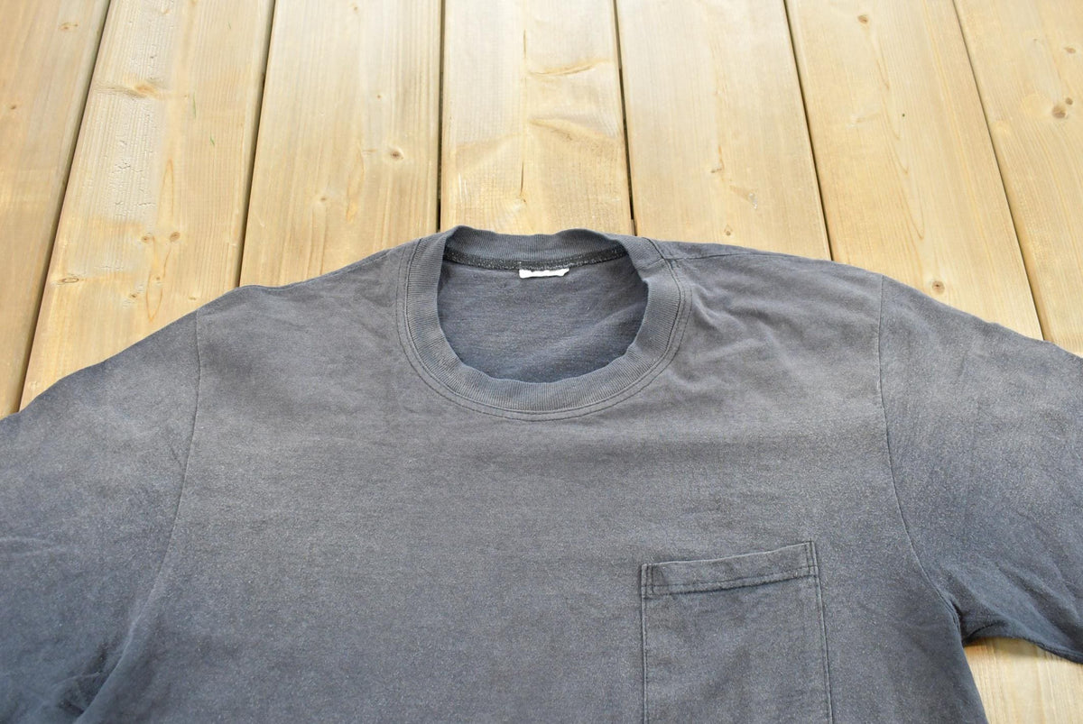 Vintage 1990s Faded Blank Black Pocket T-Shirt Men's L from propervintagecanada