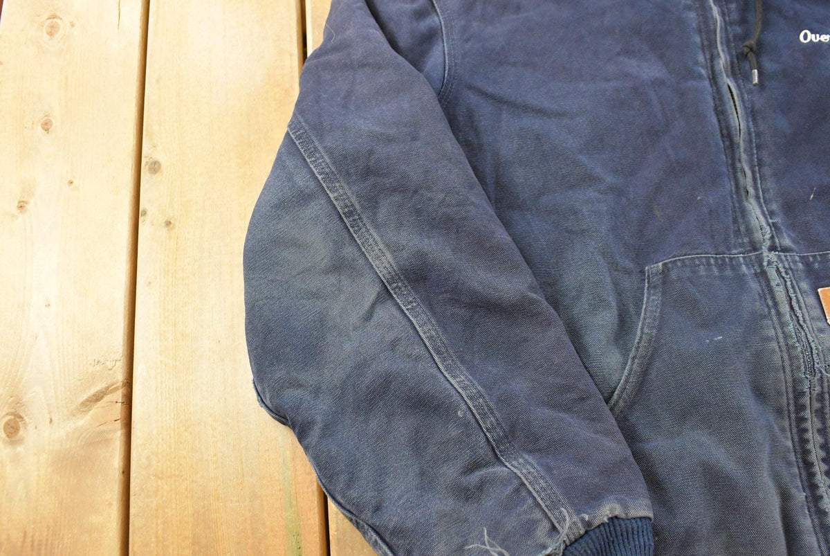 Vintage 1990s Faded Distressed Carhartt Promotional Embroidered Hooded Active Work Jacket Men's L / Workwear / 90s Streetwear / Outerwear from propervintagecanada
