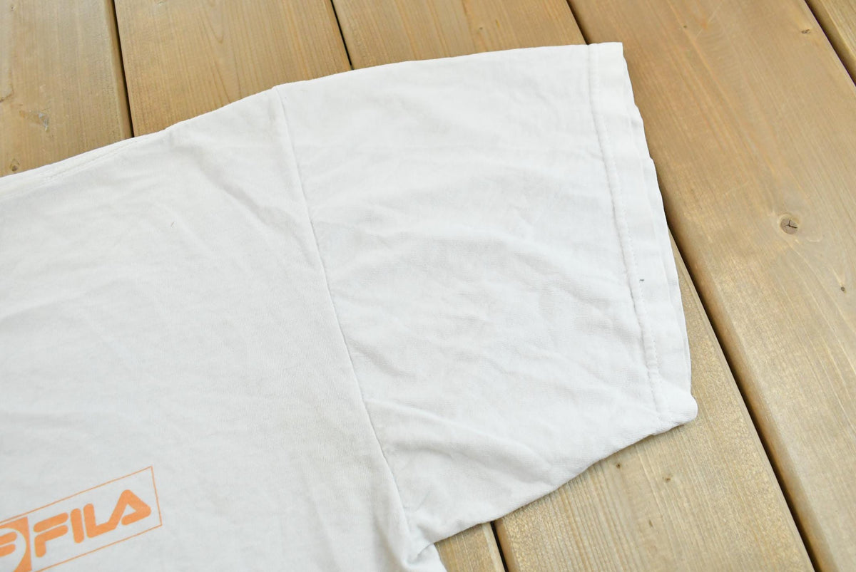 Vintage 1990s Fila Logo Graphic T-Shirt Men's 2XL from propervintagecanada