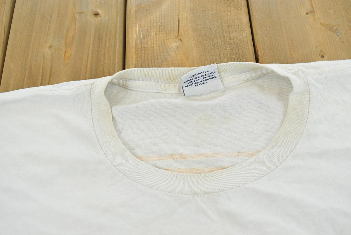 Vintage 1990s Fila Logo Graphic T-Shirt Men's 2XL from propervintagecanada