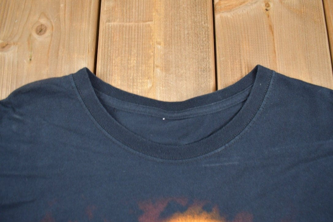 Vintage 1990s Flaming Skull Graphic T-Shirt Men's XL from propervintagecanada