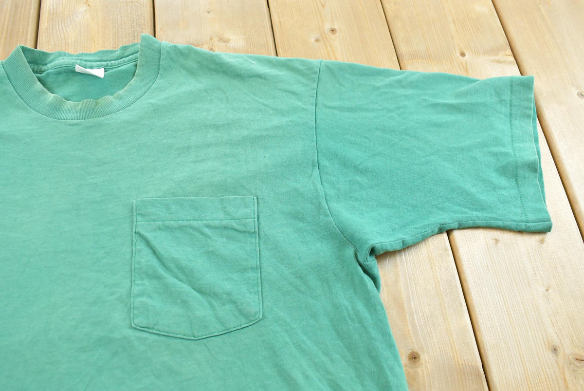 Vintage 1990s Fruit of the Loom Blank Green Pocket T-Shirt Men's L from propervintagecanada