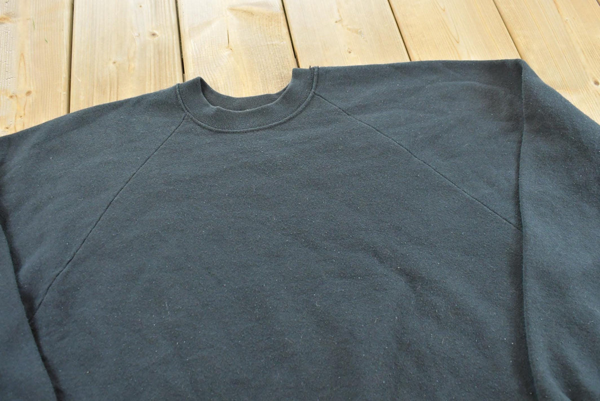 Vintage 1990s Fruit of the Loom Blank Raglan Crewneck Sweatshirt Men's L from propervintagecanada