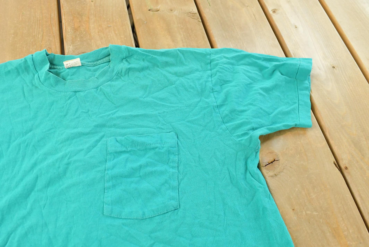 Vintage 1990s Fruit of the Loom Blank Teal Pocket T-Shirt Men's L from propervintagecanada