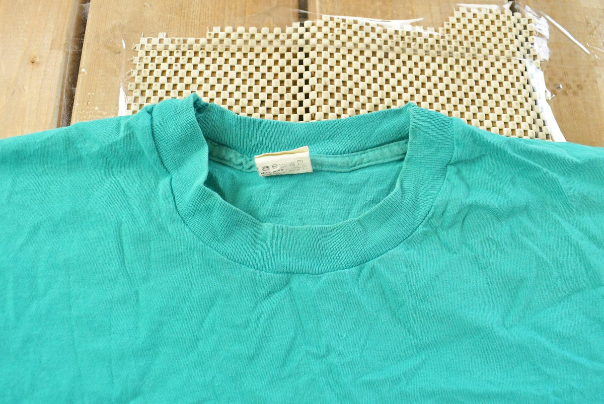 Vintage 1990s Fruit of the Loom Blank Teal Pocket T-Shirt Men's L from propervintagecanada