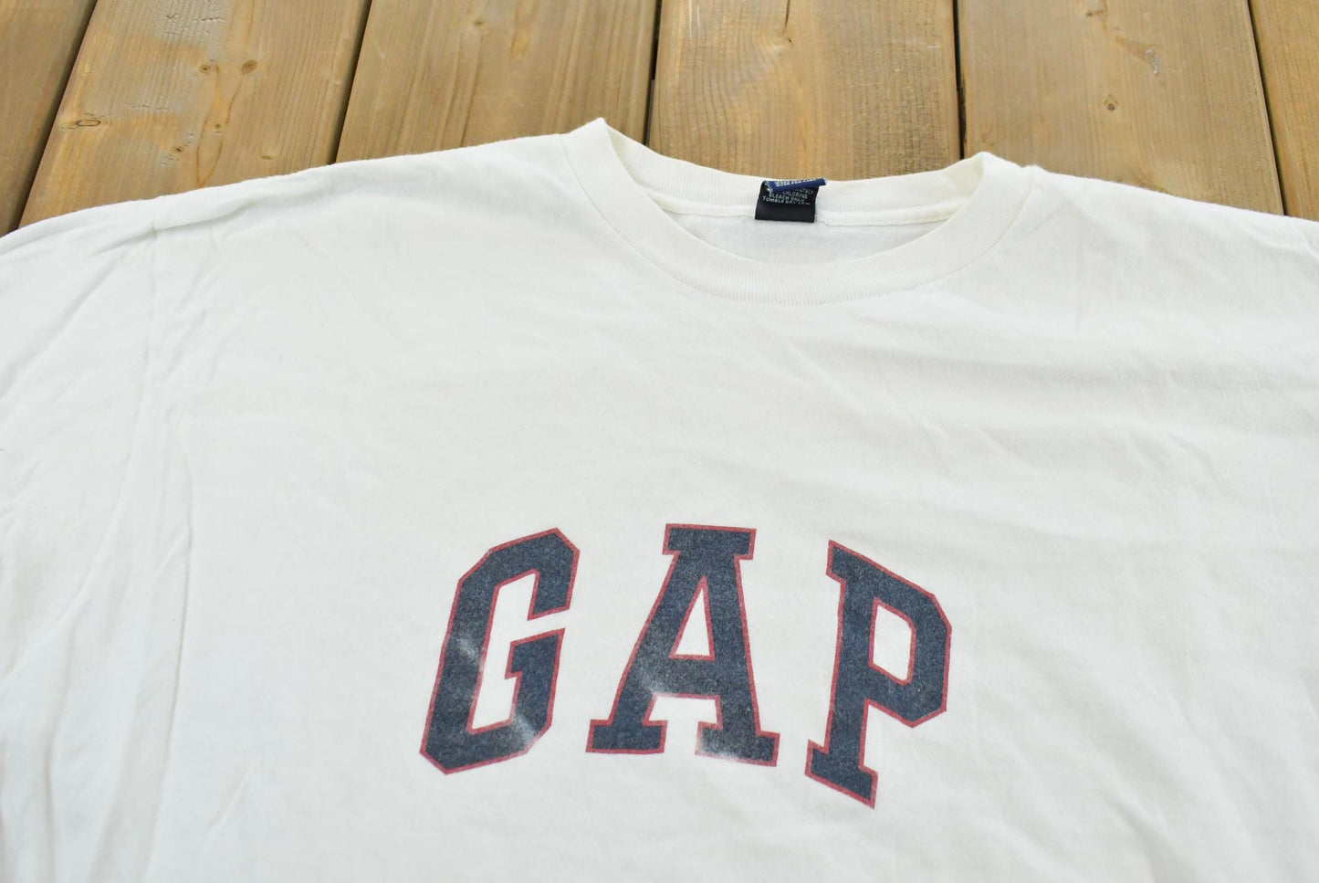 Vintage 1990s Gap Logo Spellout T-Shirt Men's L from propervintagecanada