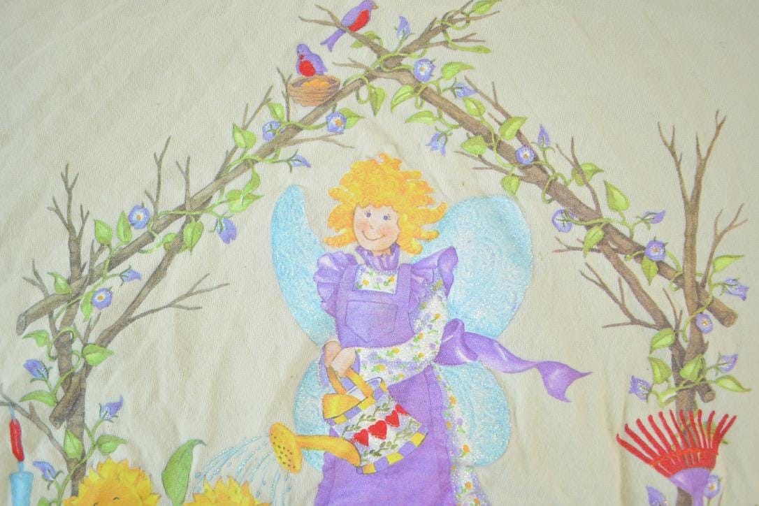 Vintage 1990s Garden Lady Atlas Angel Souvenir Single Stitch Graphic Print T-Shirt Men's XL from propervintagecanada