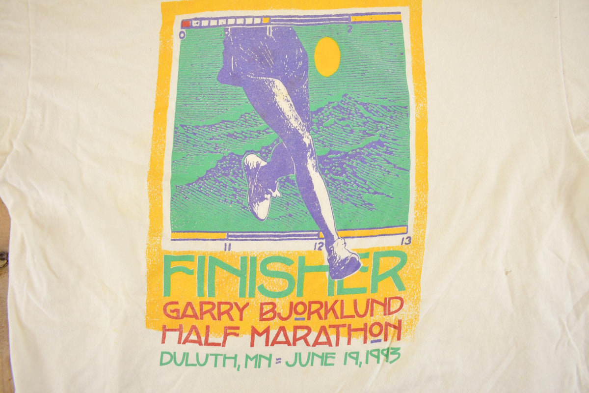 Vintage 1990s Garry Bjorklund Half Marathon Finisher Graphic T-Shirt Men's M from propervintagecanada