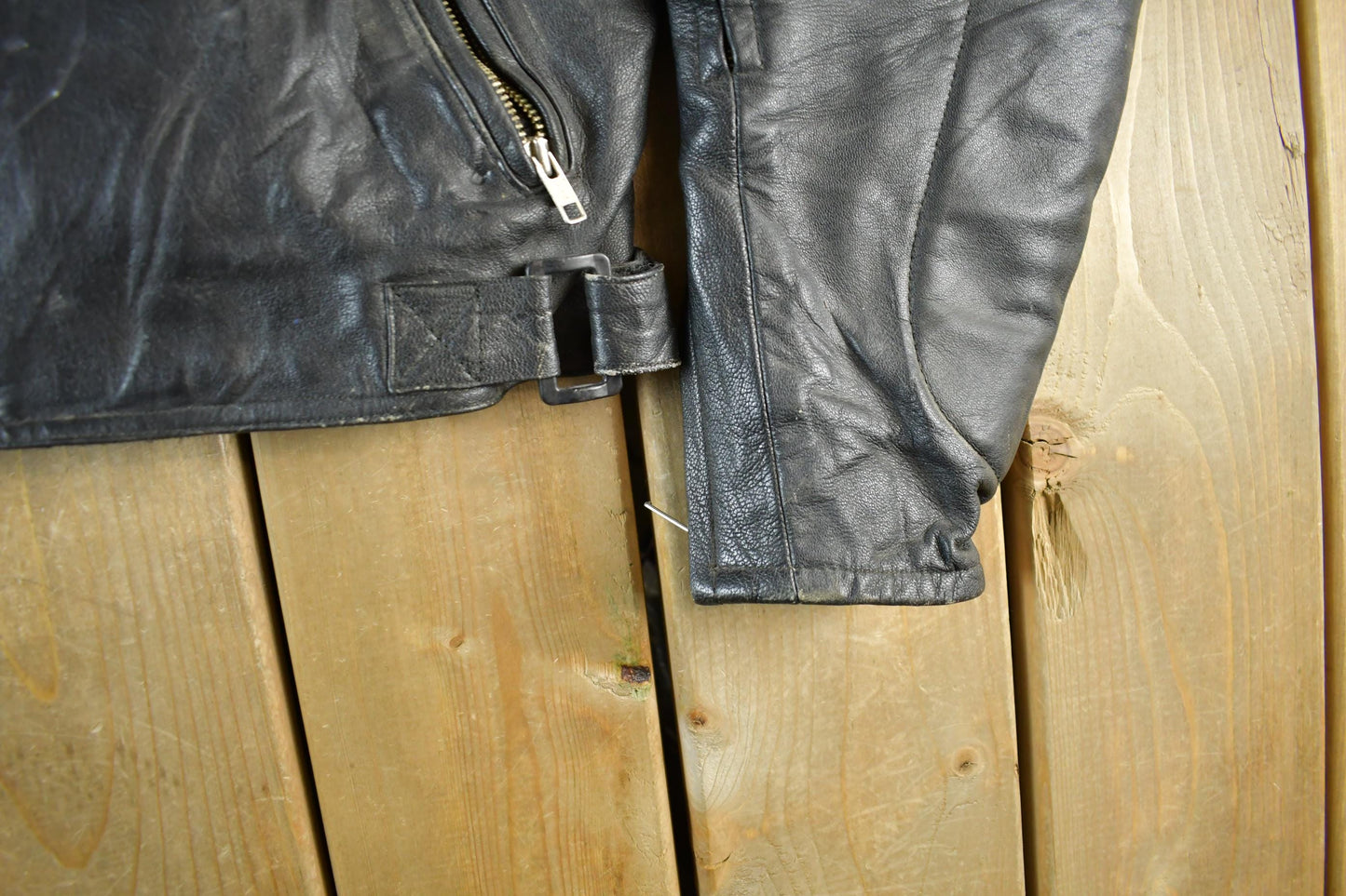 Vintage 1990s Genuine Leather Biker Jacket Padded Sleeve Adult Large Men's Medium from propervintagecanada