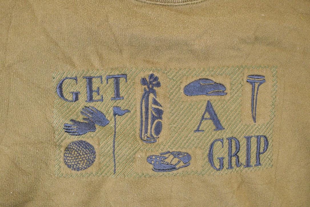 Vintage 1990s Get A Grip Embroidered Golf Crewneck Sweatshirt Men's L from propervintagecanada