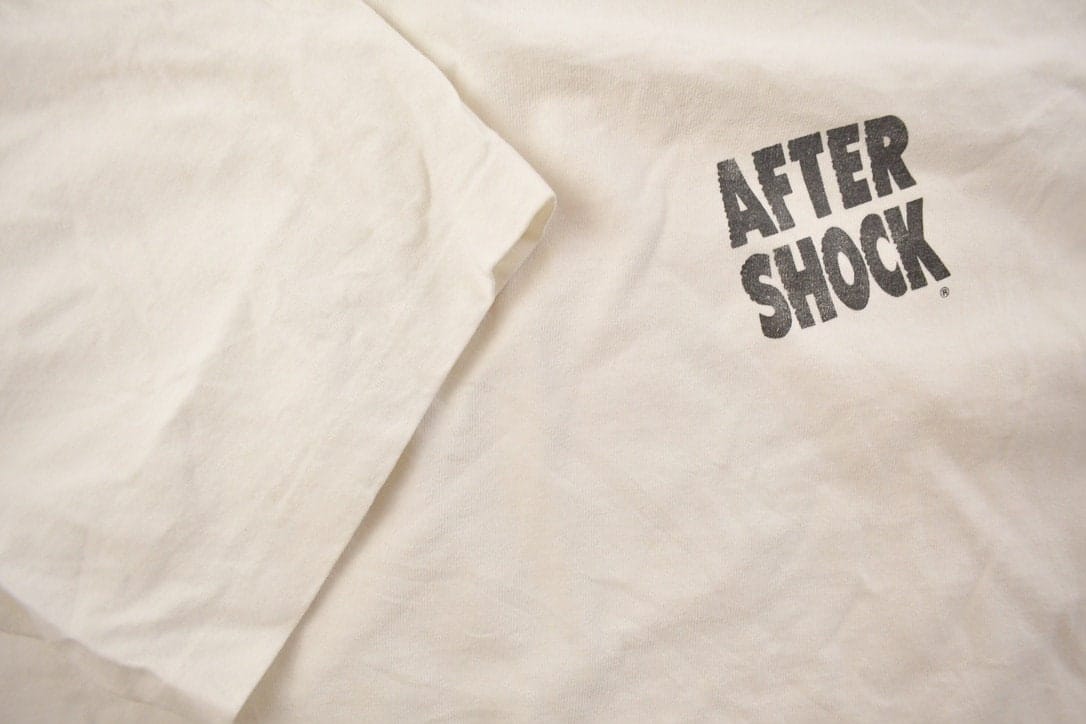 Vintage 1990s Get Shocked Graphic T Shirt Men's Medium from propervintagecanada