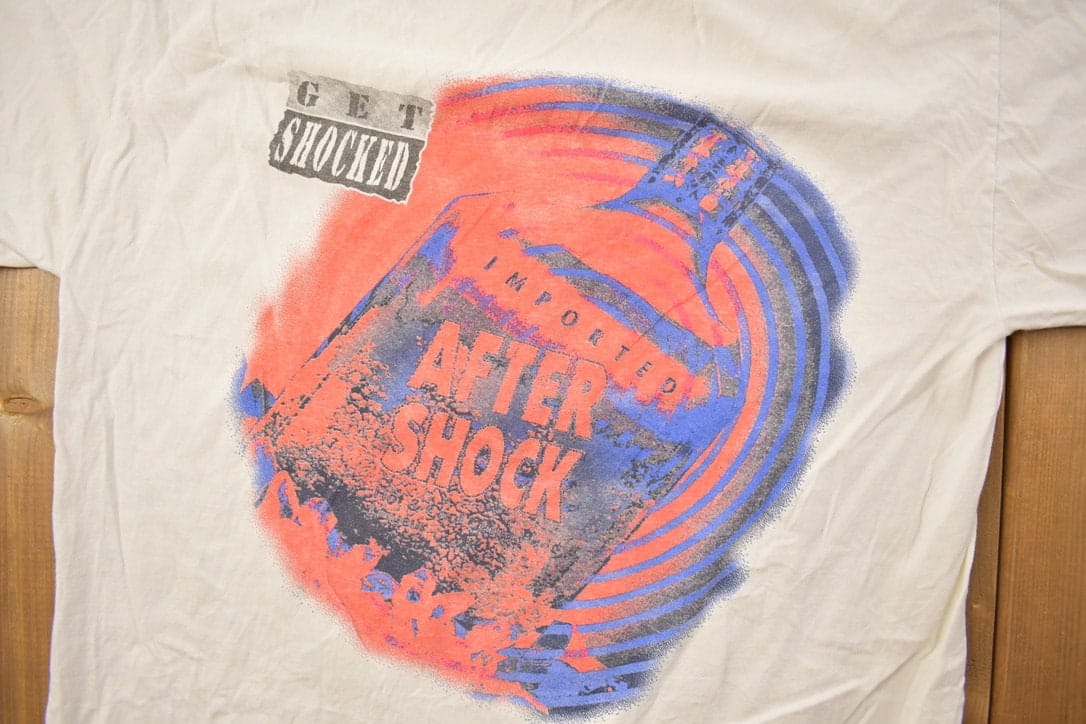 Vintage 1990s Get Shocked Graphic T Shirt Men's Medium from propervintagecanada