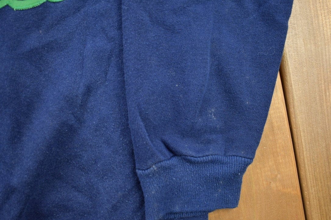 Vintage 1990s Graphic Crewneck Sweatshirt Men's Small from propervintagecanada