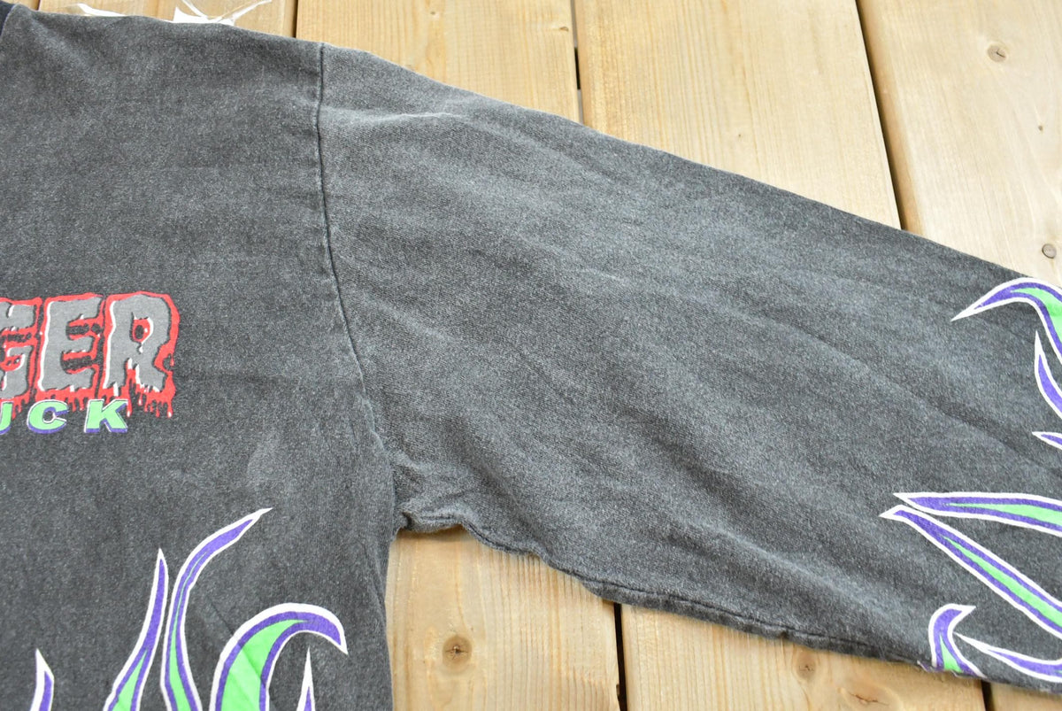 Vintage 1990s Grave Digger Flame AOP Monster Truck Graphic Long Sleeve T-Shirt Men's XL from propervintagecanada