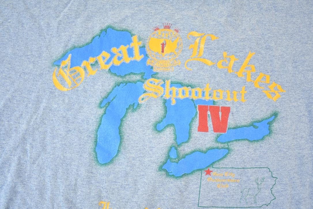 Vintage 1990s Great Lakes Shootout Gem City Outdoorsmen Graphic T-Shirt Men's Large from propervintagecanada