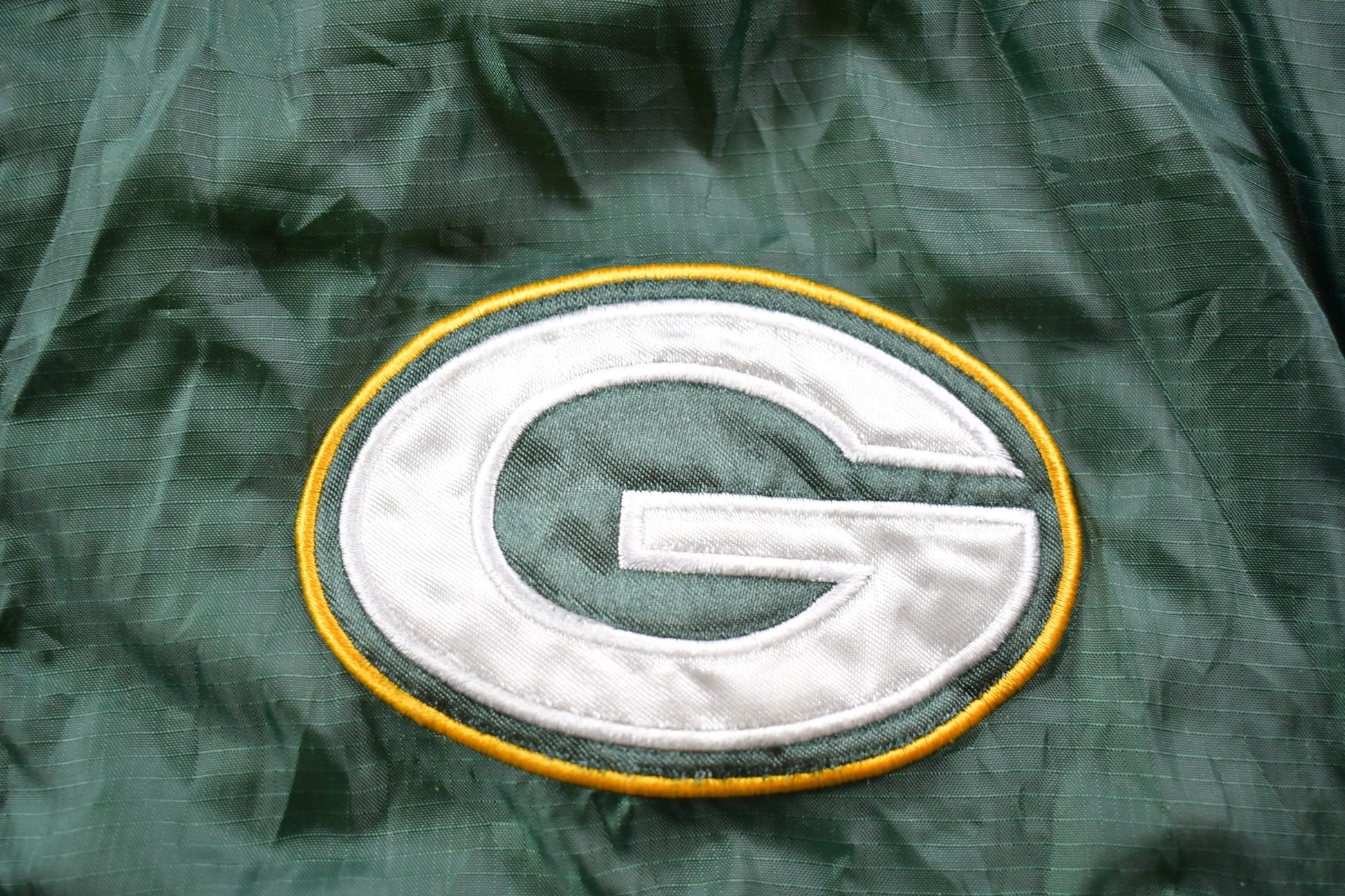 Vintage 1990s Green Bay Packers Logo Fleece Lined Convertible Jacket Men's Large from propervintagecanada