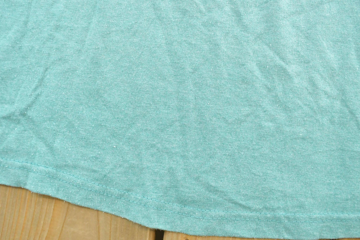 Vintage 1990s Hanes Blank Teal Pocket T-Shirt Men's 2XL from propervintagecanada