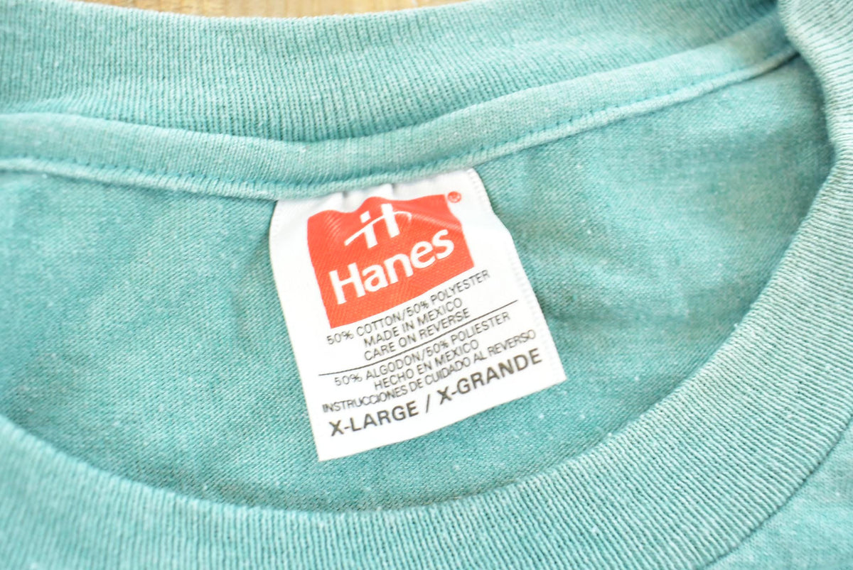 Vintage 1990s Hanes Blank Teal Pocket T-Shirt Men's 2XL from propervintagecanada
