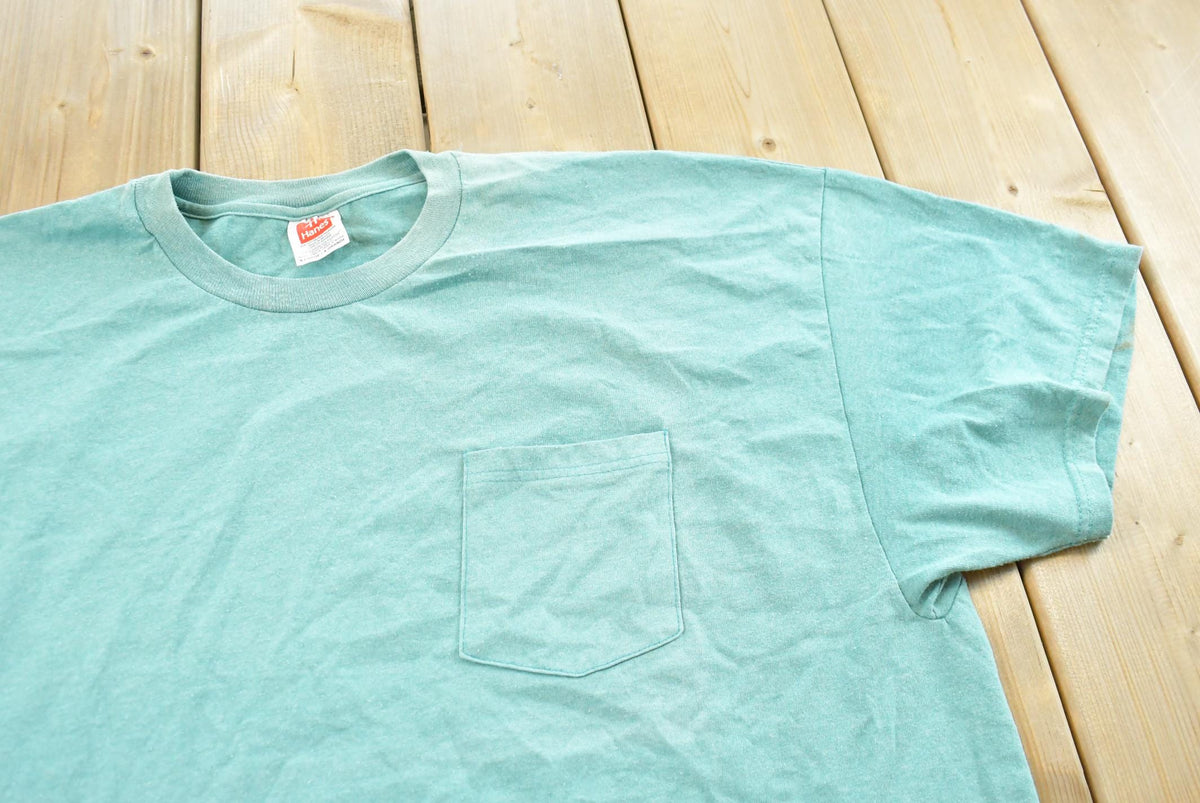 Vintage 1990s Hanes Blank Teal Pocket T-Shirt Men's 2XL from propervintagecanada
