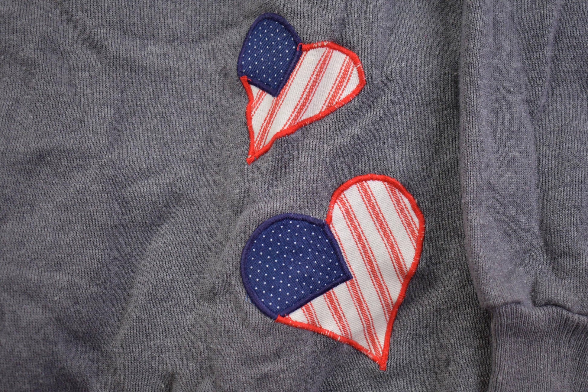 Vintage 1990s Hanes Embroidered USA Hearts Crewneck Sweater Men's XL from propervintagecanada