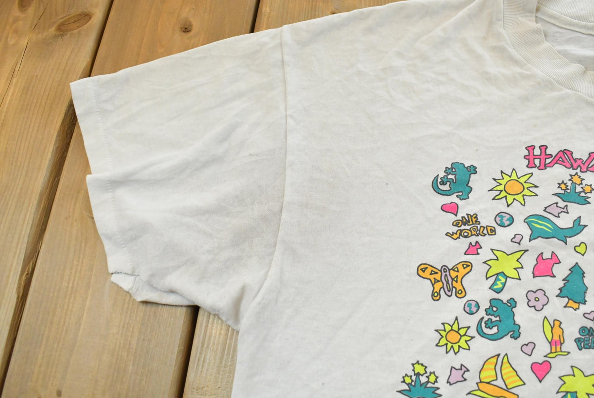 Vintage 1990s Hanes Hawaii Souvenir Graphic T-Shirt Men's L from propervintagecanada