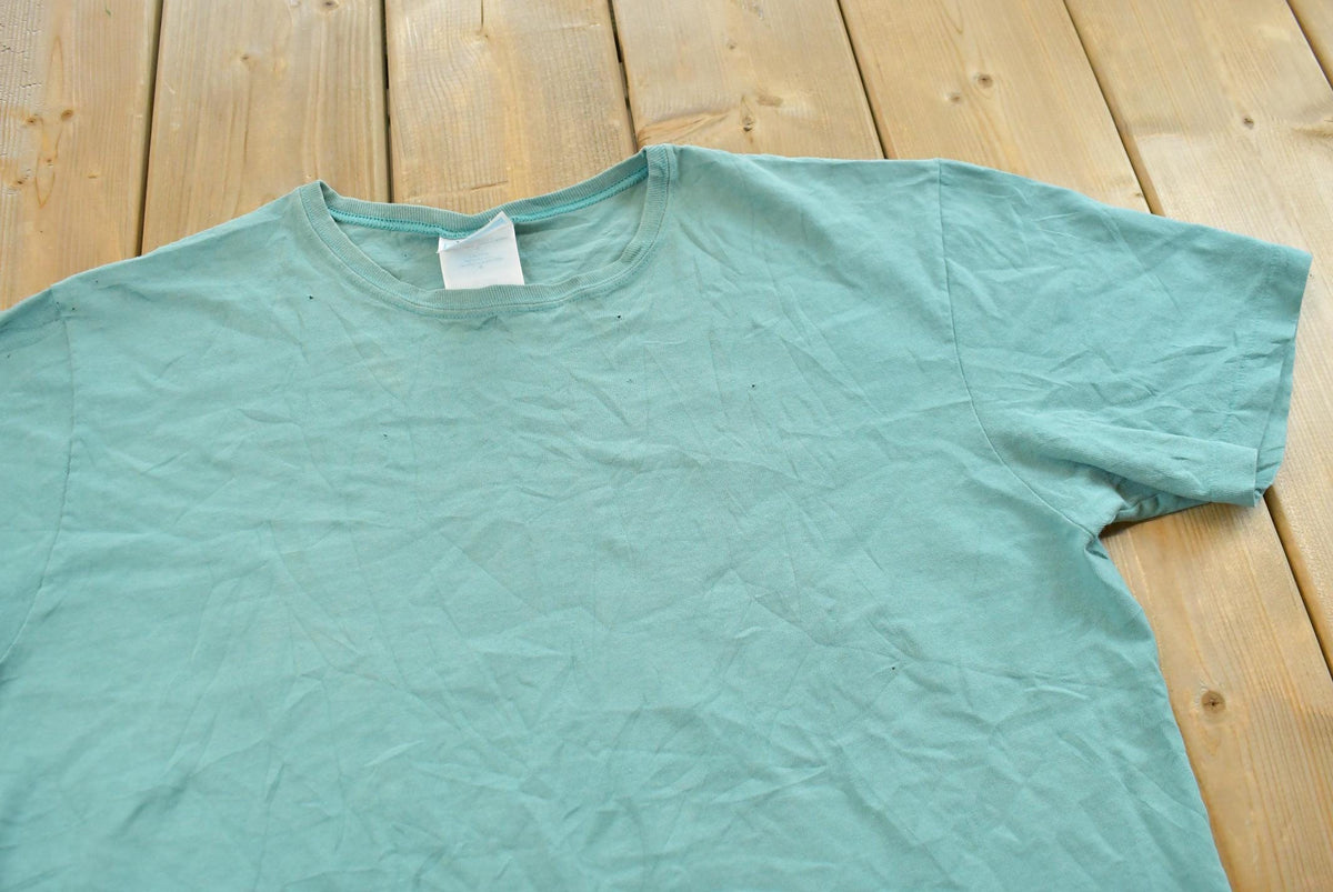 Vintage 1990s Hanes Her Way Teal Blank T-Shirt Men's L from propervintagecanada