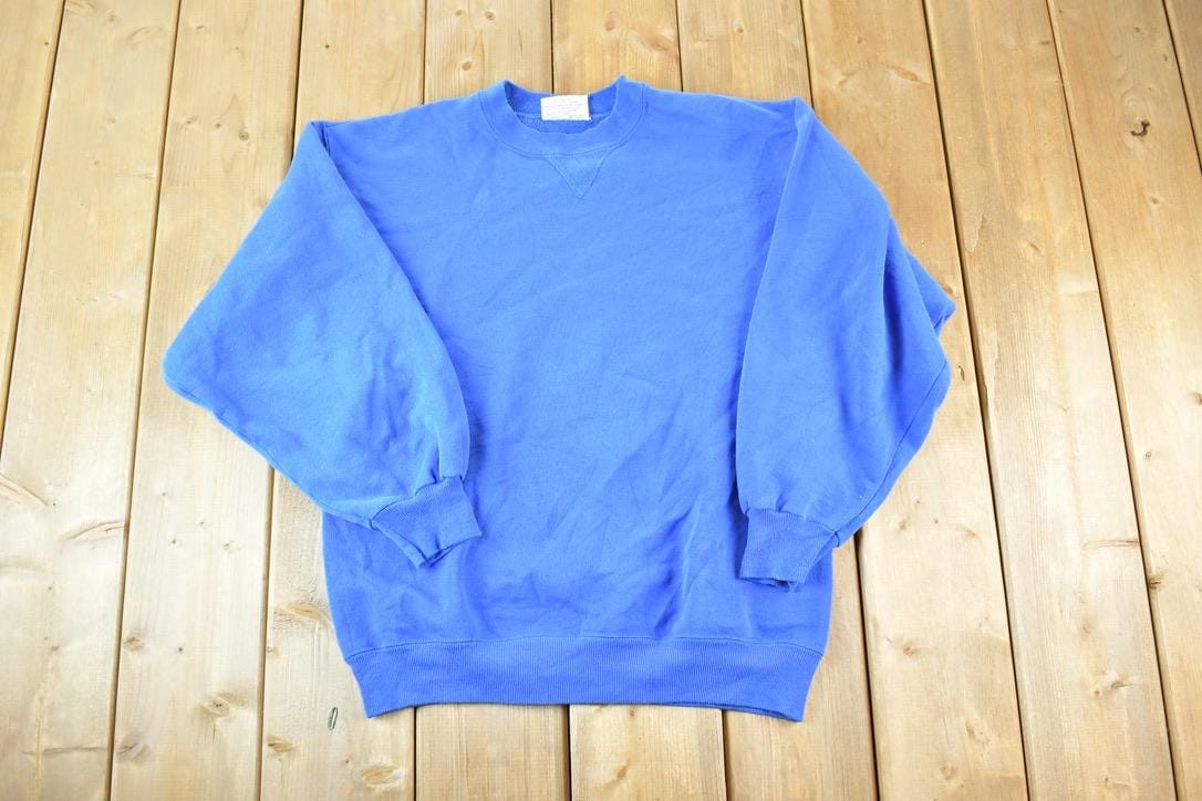Vintage 1990s Hanes Souvenir Crewneck Sweatshirt Made In USA Men's Large from propervintagecanada