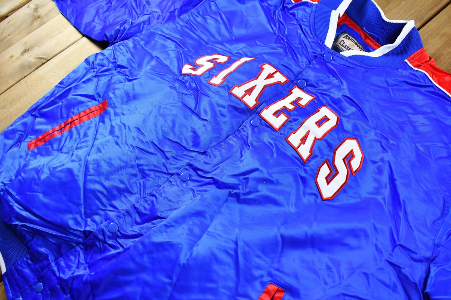 Vintage 1990s Hardwood Classics Philadelphia 76ers NBA Basketball Embroidered Snap Button Satin Bomber Jacket Men's 3XL from propervintagecanada