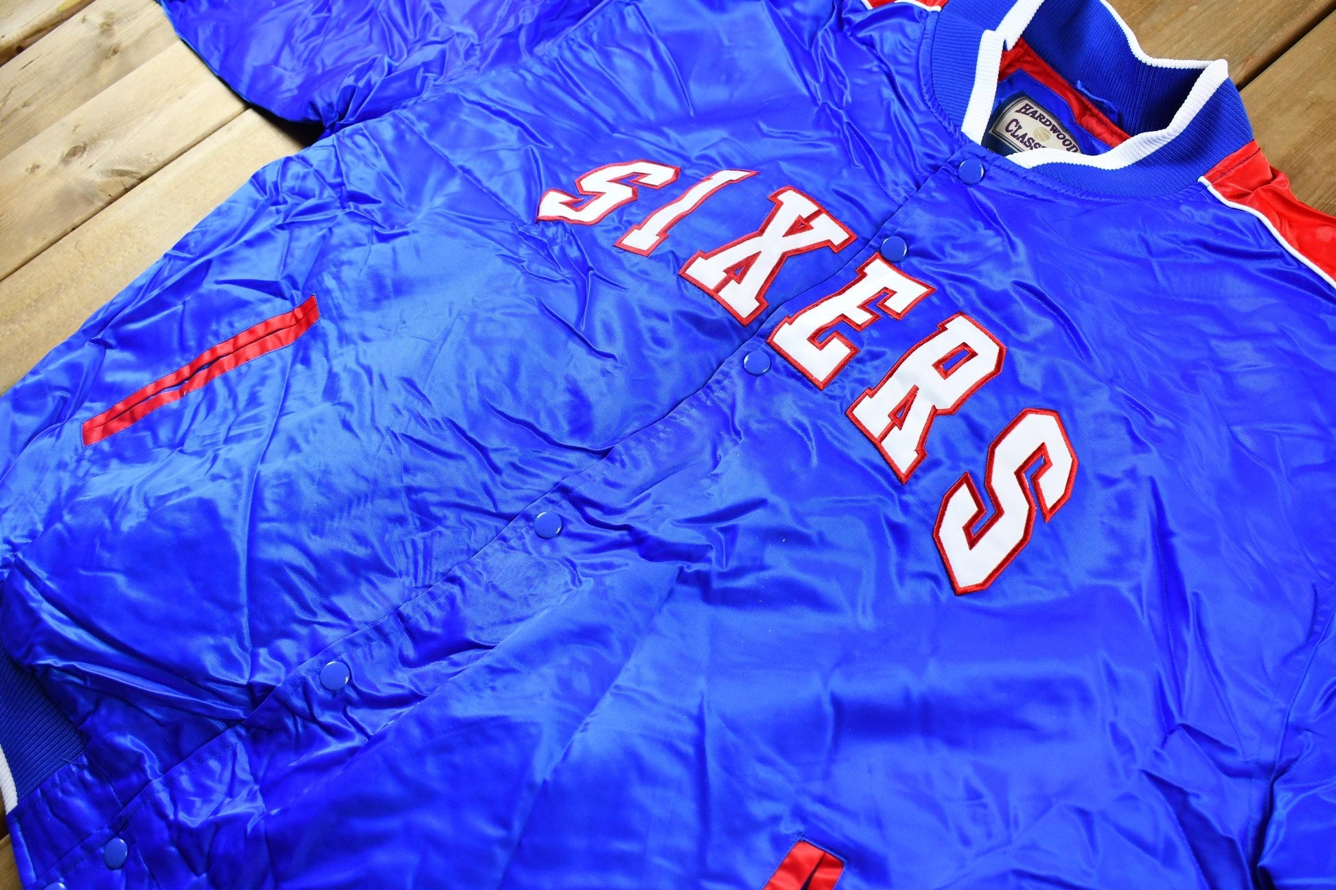 Vintage 1990s Hardwood Classics Philadelphia 76ers NBA Basketball Embroidered Snap Button Satin Bomber Jacket Men's 3XL from propervintagecanada