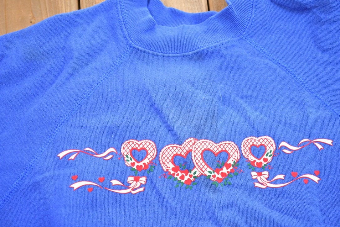 Vintage 1990s Heart Theme Crewneck Sweater Men's XL from propervintagecanada
