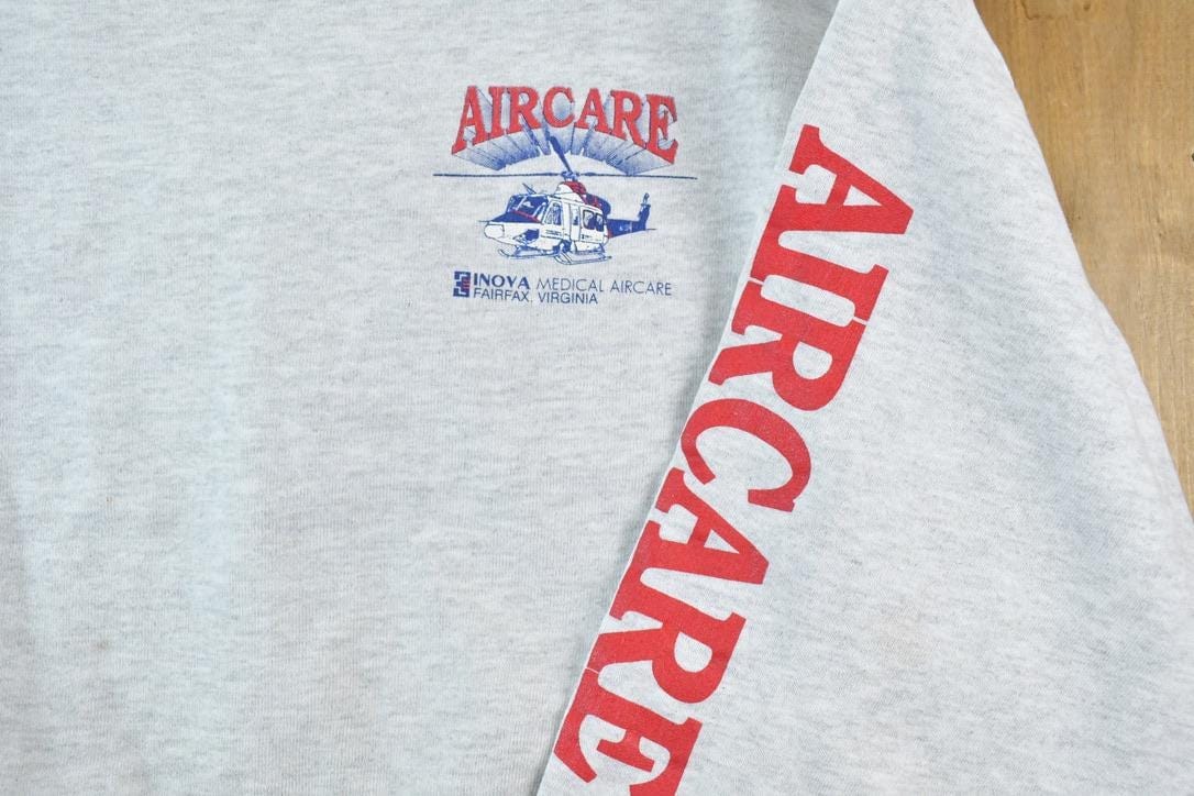 Vintage 1990s Helicopter Air Care Crewneck Sweatshirt Made In USA Men's XL from propervintagecanada