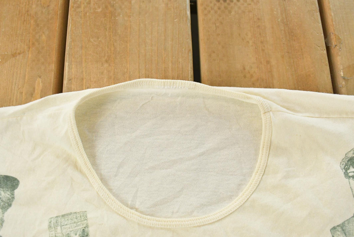 Vintage 1990s Historical Authors All Over Print Sleeping T-Shirt Men's XL from propervintagecanada