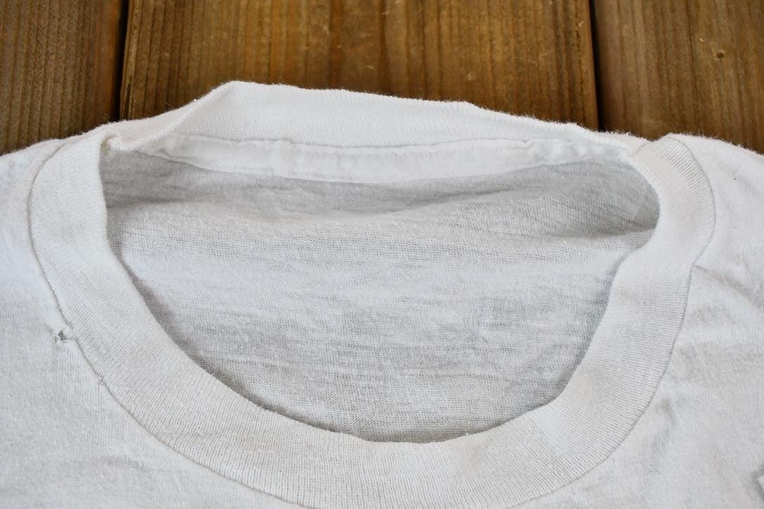 Vintage 1990s Hot Tub Club Tropical Penguins Single Stitch Graphic T-Shirt Men's Small from propervintagecanada