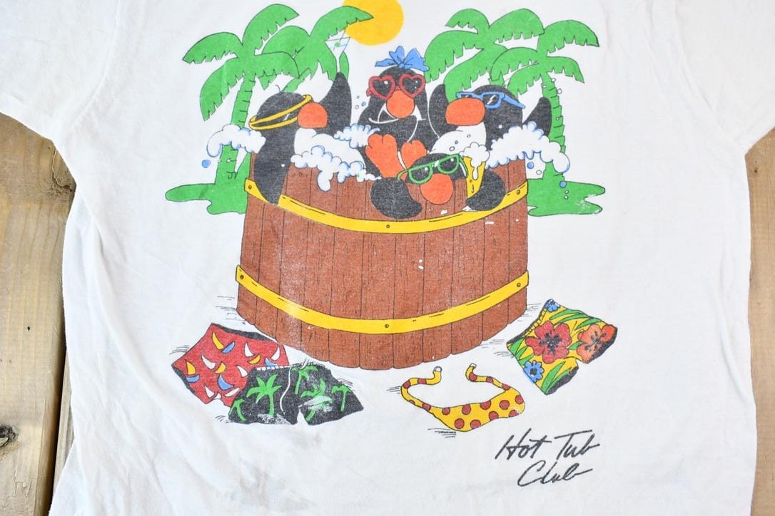 Vintage 1990s Hot Tub Club Tropical Penguins Single Stitch Graphic T-Shirt Men's Small from propervintagecanada