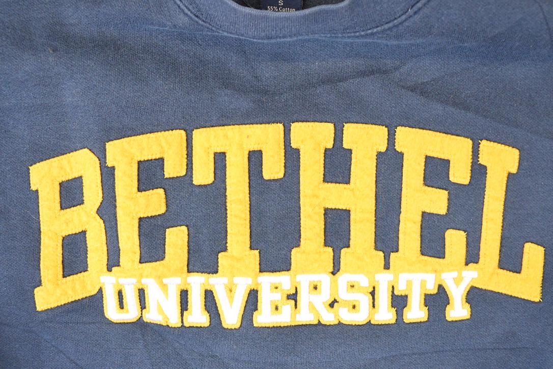 Vintage 1990s Jansport Bethel University Embroidered Crewneck Sweater Mens S from propervintagecanada