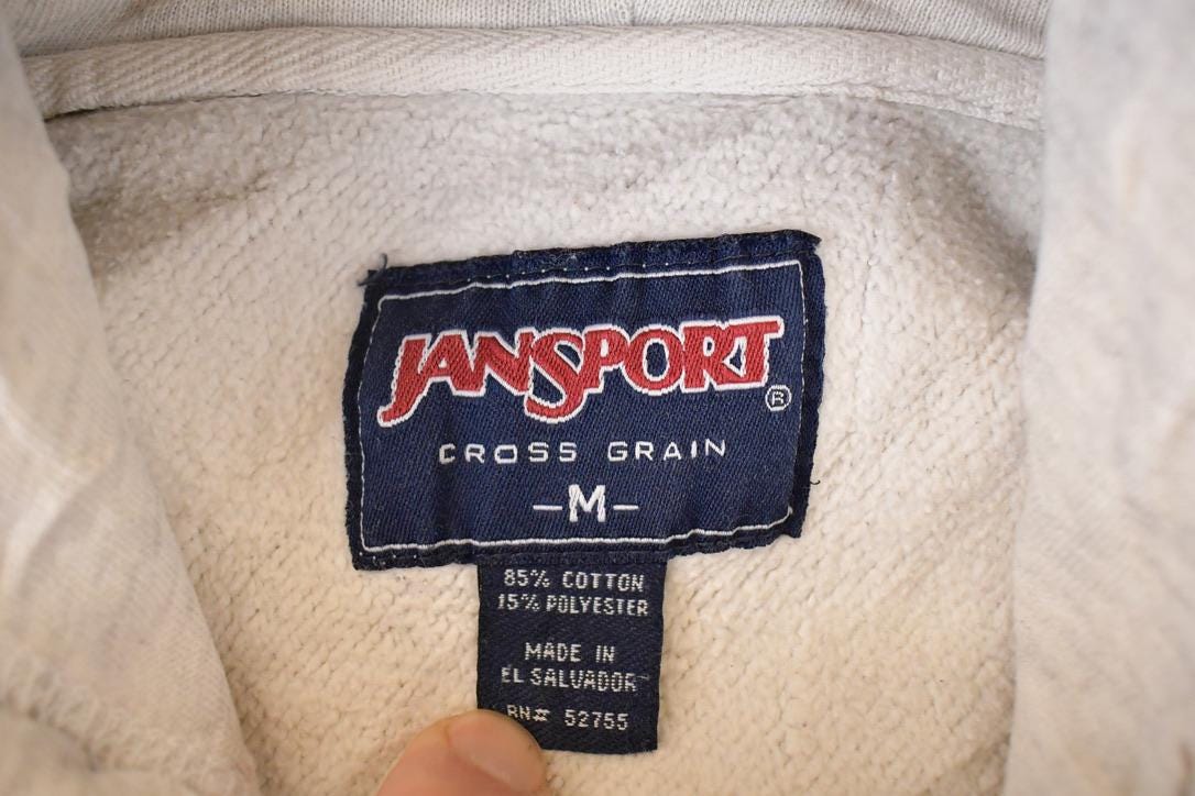 Vintage 1990s Jansport Cross Grain Johnnies Graphic Print Hoodie Sweatshirt Men's M from propervintagecanada