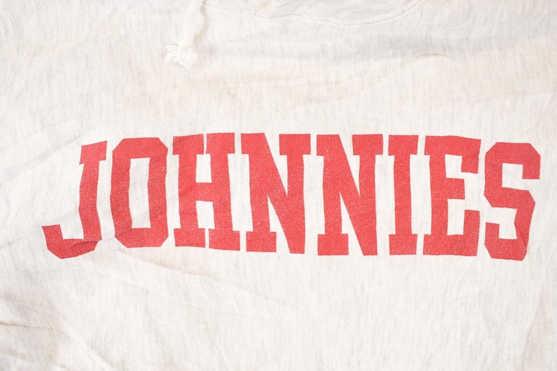 Vintage 1990s Jansport Cross Grain Johnnies Graphic Print Hoodie Sweatshirt Men's M from propervintagecanada