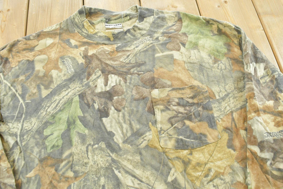 Vintage 1990s Jerzees Advantage Timber Camo Long Sleeve T-Shirt Men's L from propervintagecanada
